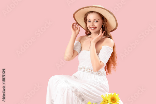 Young woman in summer hat w...
