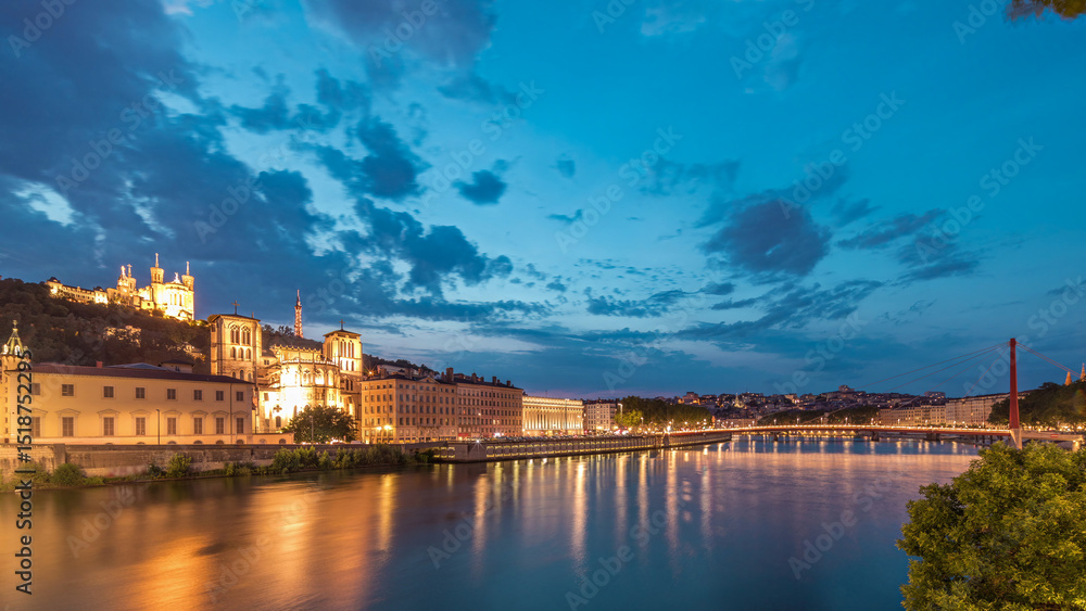 Fototapeta premium Timelapse of Saint John the Baptist Cathedral and Basilica of Notre-Dame de Fourviere in Lyon, from day to night. France