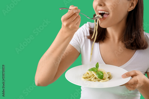 Young woman eating tasty pa...