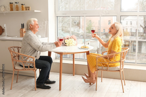 Mature couple drinking wine...