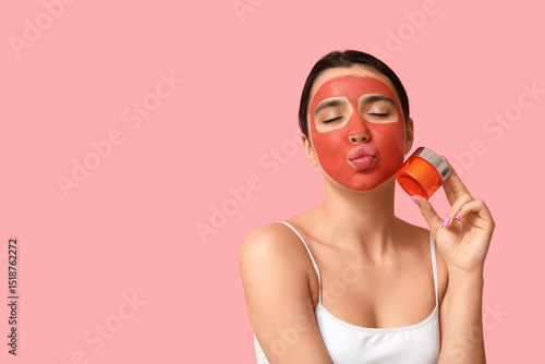 Young woman with facial mas...