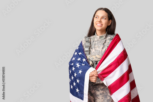 Female soldier with USA fla...