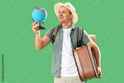 Male tourist with globe and...