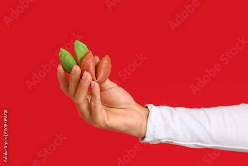 Female hand holding colorfu...