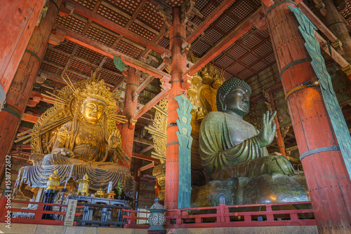 Nara, Japan - Sep 26 2024, Panoramic view of the Sitting Buddha Vairochana, a fifteen-meter bronze statue of Buddha, and a side-standing gilded statue of Buddha, at Todaiji Temple, Nara, Japan