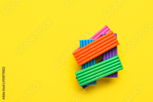 Colorful plasticine on yell...
