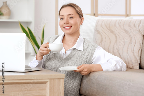 Young woman with cup of cof...