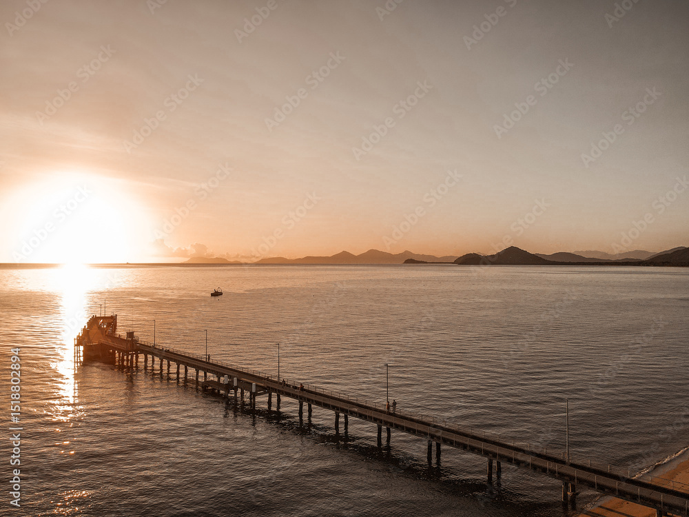 Sunrise Drone View Over Palm Cove Jetty – Golden Light and Calm Waters Sunrise Drone View Over Palm Cove Jetty – Golden Light and Calm Waters