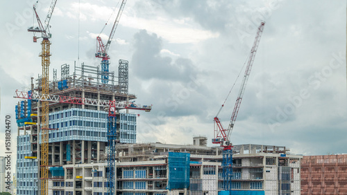 Photography Construction site of a modern skyscraper in Singapore timelapse