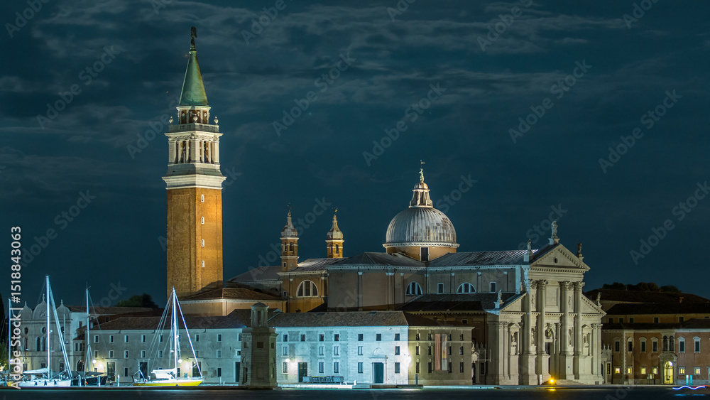 Fototapeta premium A view of the Cathedral of San Giorgio Maggiore from San Marco square at night timelapse, Venice, Italy