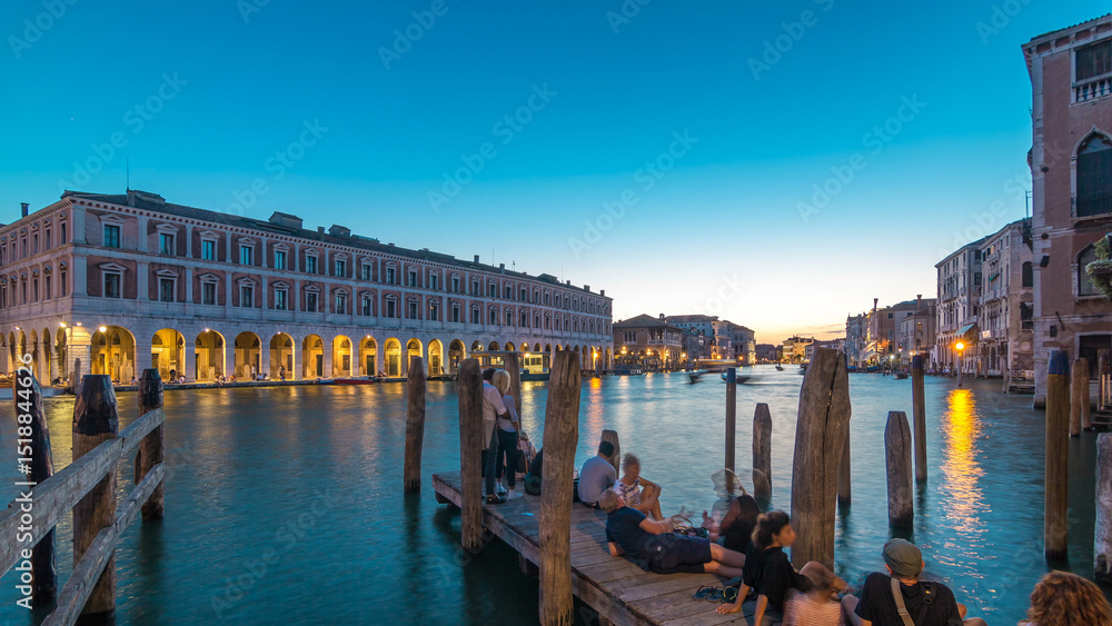 Naklejka premium View of the deserted Rialto Market day to night timelapse after sunset, Venice, Italy viewed from pier across the Grand Canal