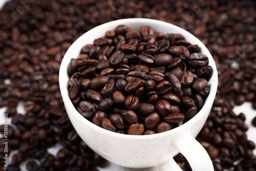 Wallpaper Mural Close-up of roasted brown coffee beans piled together, showcasing rich texture, aroma, and freshness on a white studio background. Torontodigital.ca