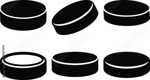 A group of black hockey pucks in different positions, a vector image