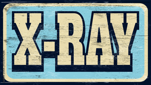 Aged and worn x-ray sign on wood