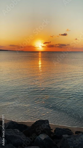 Wallpaper Mural Vertical shot of reflected sunset with sea waves Torontodigital.ca