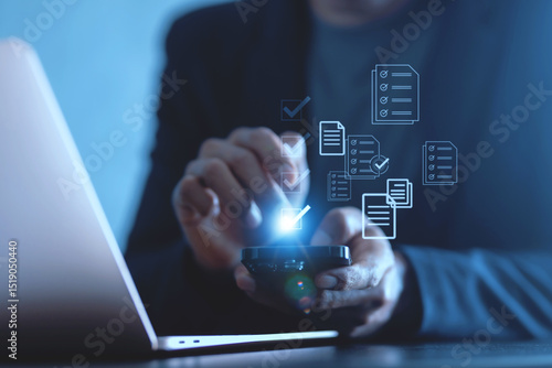 Checklist business performance monitoring concept, Business using smartphone and laptop online survey filling out check digital form task.