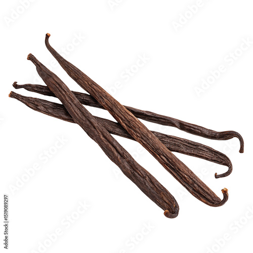 A detailed close up of several vanilla beans against a stark black background showing their texture detail