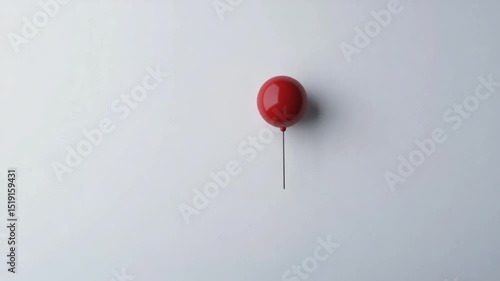 Single red balloon against white background