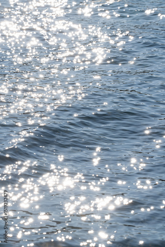 Sunlight reflecting on gently moving water surface