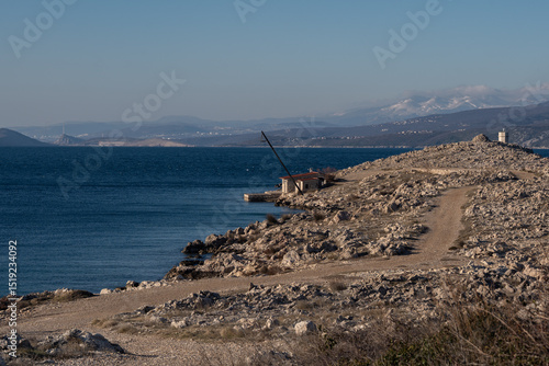 Rocky coastline stretching into the adriatic sea on Krk, croatia