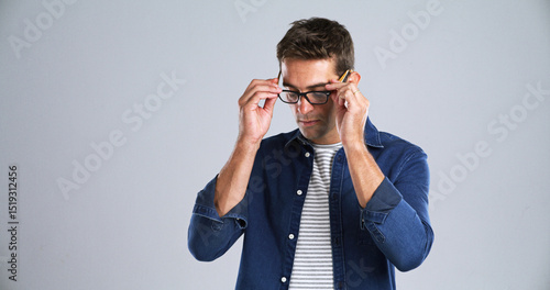 Tableau sur toile Man, glasses and optometry in studio for testing, vision or adjusting to new lens for sight