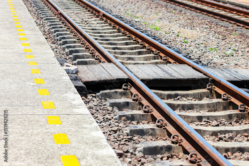 Pictures of railroad tracks in concept train station.