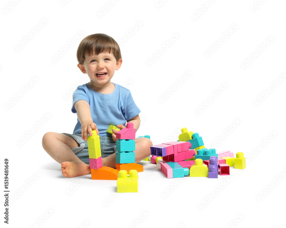 Cute little boy playing with building bricks on white background Cute little boy playing with building bricks on white background