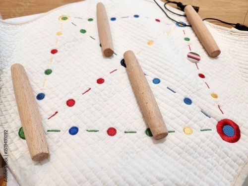 Korean traditional games on the table. There is yutnori with the wooden sticks and fabric mat.