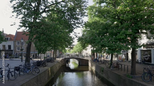 City canal with small bridge in the historic center of Delft, The Netherlands.