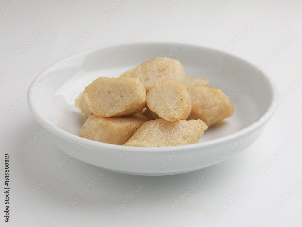 Fried rice cake on a plate, cut and served on white plate Fried rice cake on a plate, cut and served on white plate