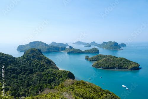 Panoramic view of the landscape of Mu Ko Ang Thong Marine Park in Thailand near Koh Samui. You can see beautiful turquoise blue water and many small tropical islands with lush vegetation.