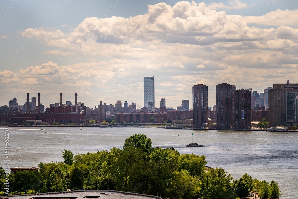 Fototapeta premium New York City skyline with river and trees.