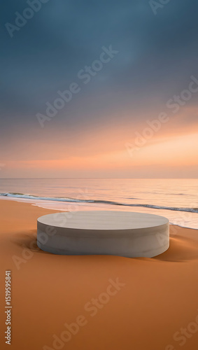 Empty cylindrical wooden product display stand on a sandy beach at sunset