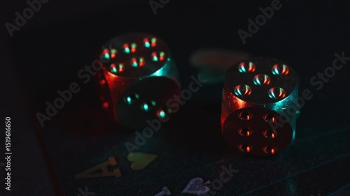 Casino games background with playing cards and dice for playing various games of chance on black table.