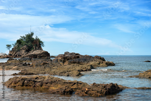Wallpaper Mural Tranquil Coastal View of Pantai Kuala Kemasik with Rocky Shoreline, Terengganu, Malaysia - This serene coastal scene captures the natural beauty of Pantai Kuala Kemasik in Terengganu, Malaysia. Torontodigital.ca