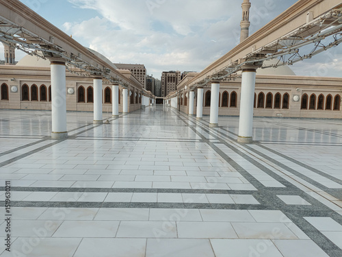 The Prophet's Mosque (Masjid Nabawi) Courtyard with Umbrellas and Minaret