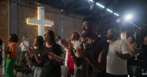 Cuadro en lienzo Multicultural congregation clapping and smiling during church worship, illuminat