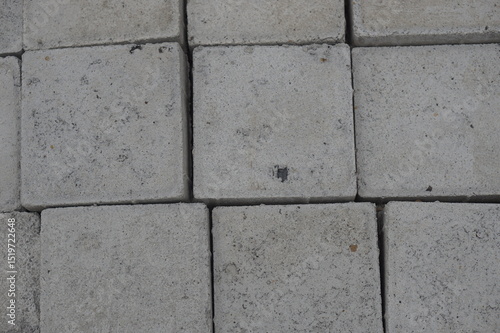 Wallpaper Mural A variety of concrete products—triangular bricks, cylindrical pipes, and rectangular blocks—neatly arranged and ready for use in construction and infrastructure projects. These materials reflect durab Torontodigital.ca