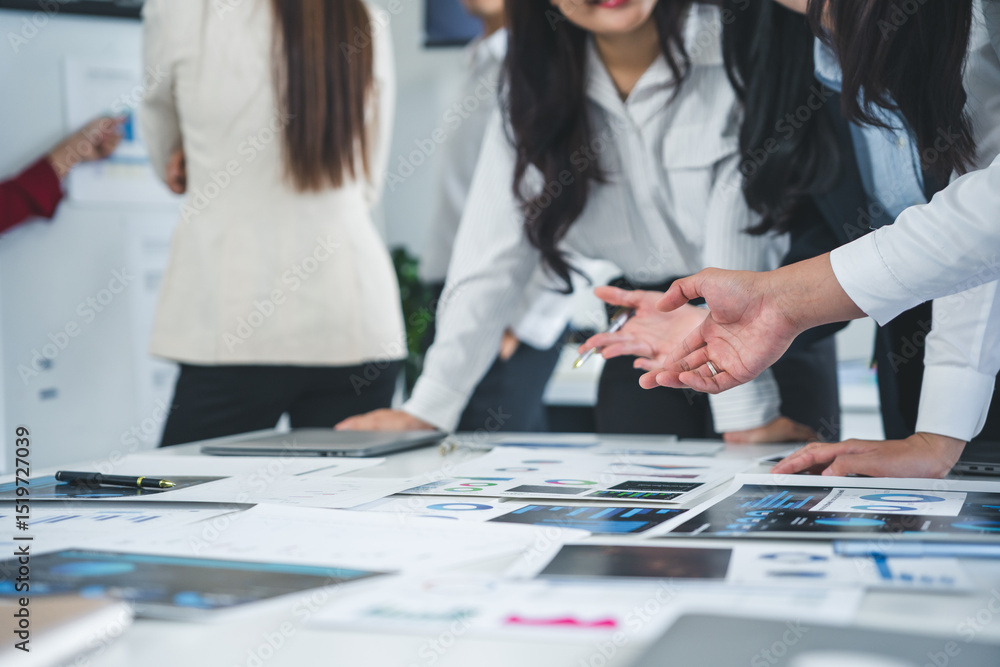 Fototapeta premium Business team analyzing financial documents and explaining investment strategy discussing new marketing data at meeting