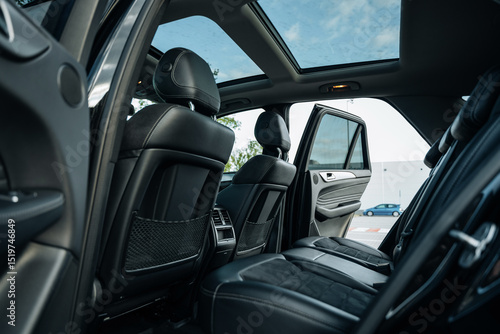 Wallpaper Mural Modern luxury SUV interior with black leather rear seats and panoramic sunroof view – elegant cabin design, spacious backseat comfort and premium upholstery for refined automotive travel experience Torontodigital.ca
