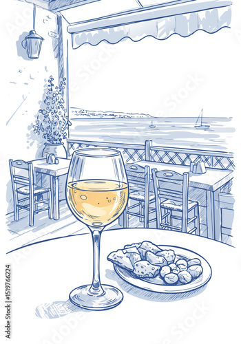 Glass of white wine with snacks on table by the seaside restaurant  