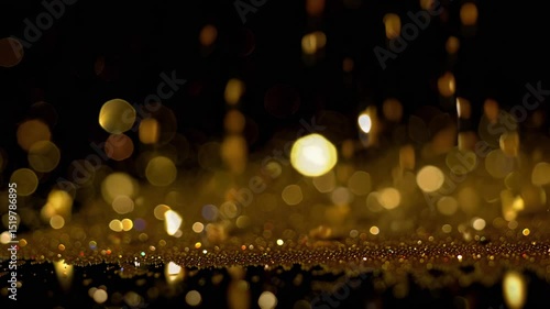 Animación cinematográfica en cámara lenta con partículas de oro cayendo y destellos brillantes