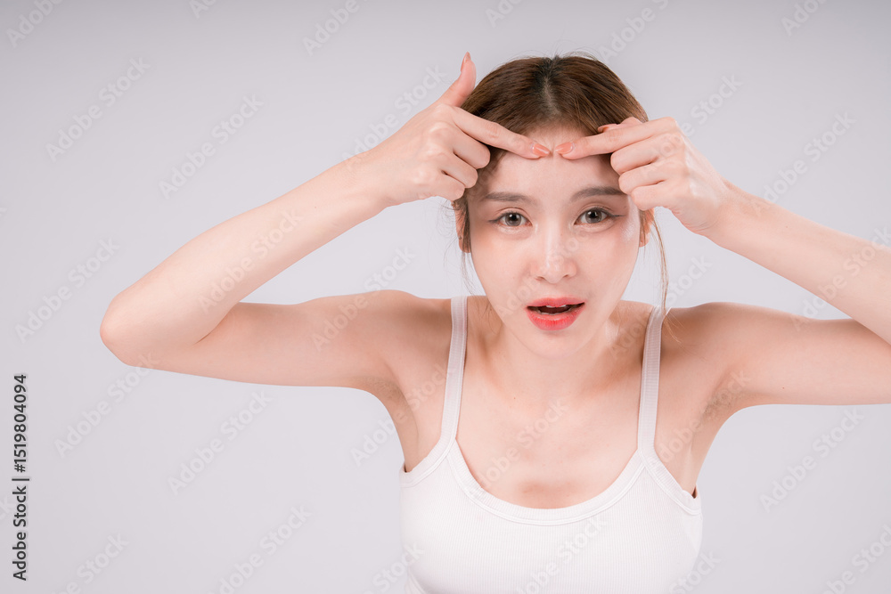Fototapeta premium Woman is looking at her face Squeeze acne