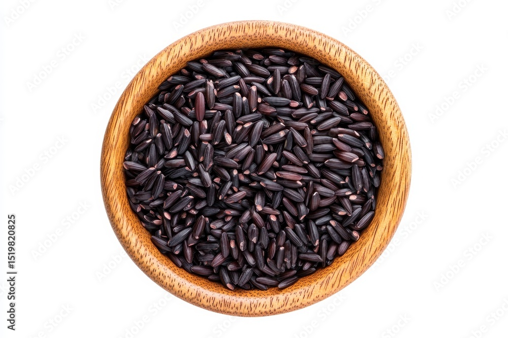 Black rice in a wooden bowl isolated on white background, a healthy and nutritious grain Black rice in a wooden bowl isolated on white background, a healthy and nutritious grain
