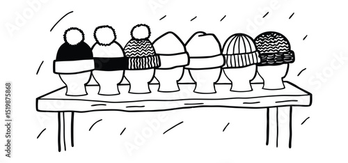 A simple black and white illustration of various winter beanies displayed on a wooden table in snowy weather