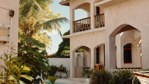 Hotel exterior with balcony and seating area, travel accommodation