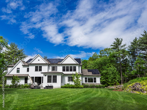 Suburban New England home generating its own energy with rooftop solar panels