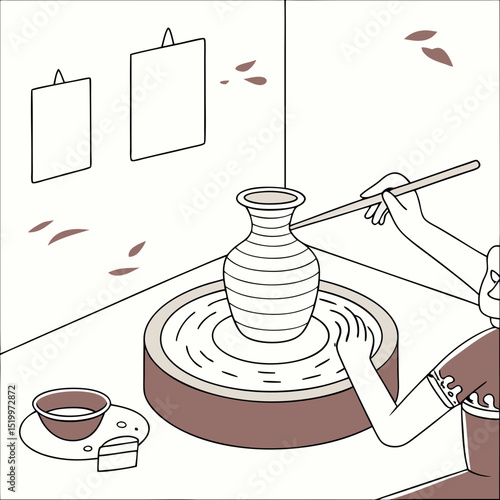 Person shaping a vase on a pottery wheel with art on the wall behind