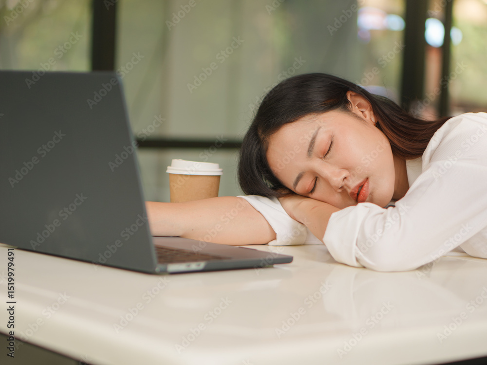 A young woman with a computer looks tired and bored working outside. A young woman with a computer looks tired and bored working outside.