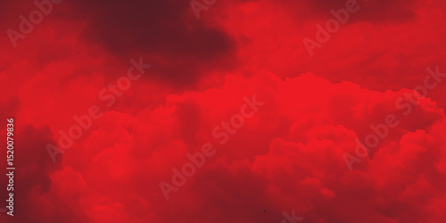 Black and red abstract background with a fiery red sky. Dramatic red sky. Red sunset with clouds. Fantastic sunset background with copy space for design.